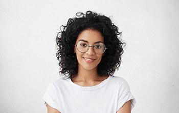 woman smiling with dental crowns in Rochester