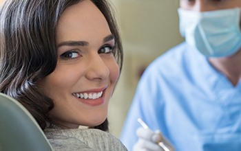 woman smiling at the dentist’s office