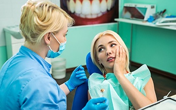 patient talking to dentist about dental emergencies in Rochester