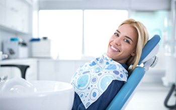 Smiling woman sitting in dental office