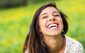 Woman smiling outdoors