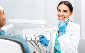 dentist in Rochester smiling toward the camera