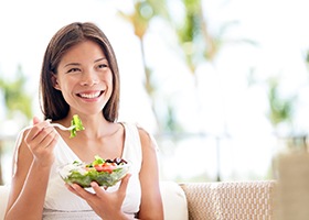 Woman eating salad in Rochester