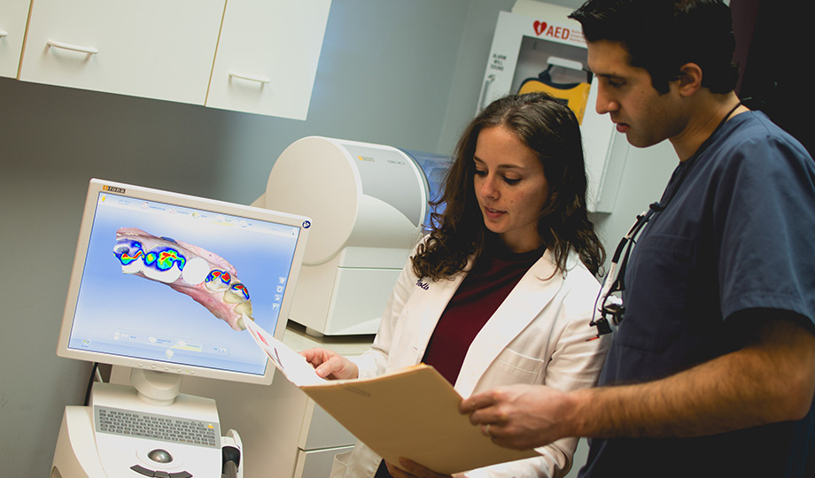 Dentists reviewing patint files