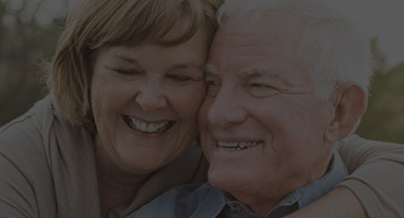 Happy senior couple smiling together