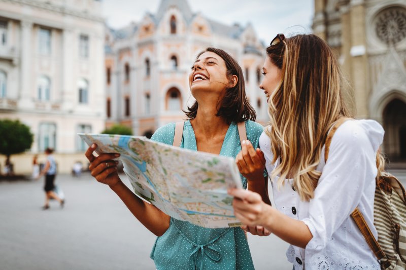 two girls laughing while traveling