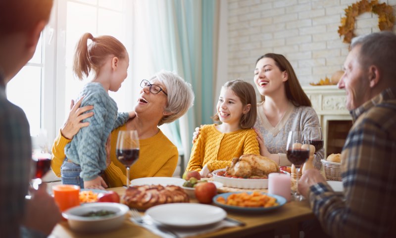 Family sitting around the table at Christmas dinner