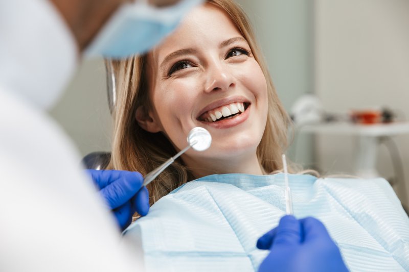 Patient smiles at her dentist